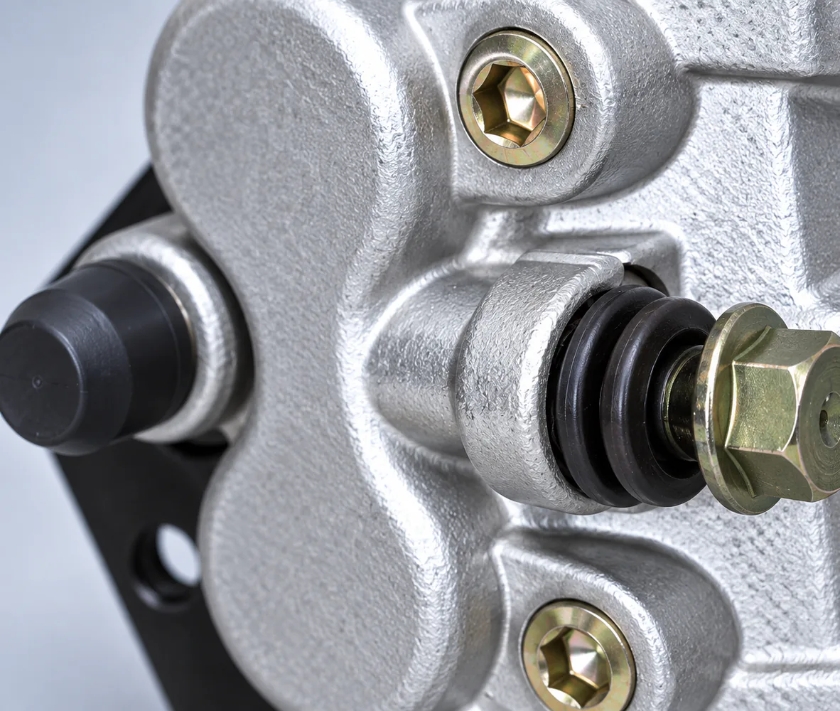 Twin-Piston Disc Brake Caliper with Mounting Bracket, close-up